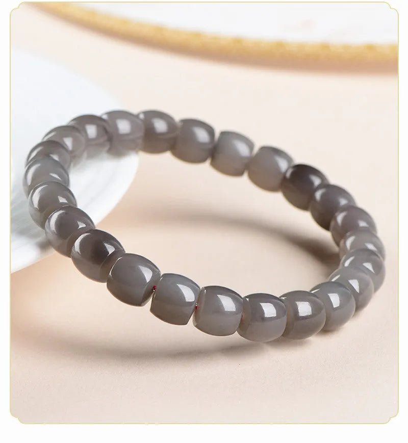 Smokey violet Hetian jade straight cut bracelet with 8x9mm beads on wrist