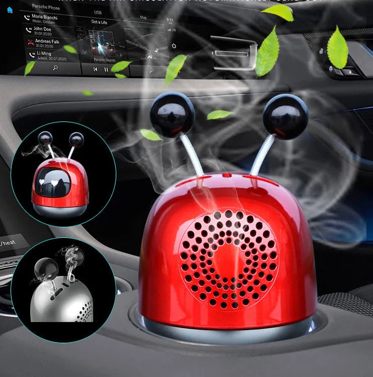 Robot-shaped car vent aromatherapy air freshener diffuser in blue, grey, or red.