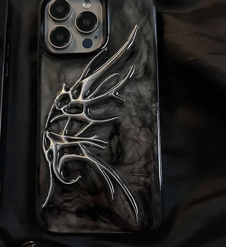 Black iPhone case with three-dimensional wings design showing textured surface