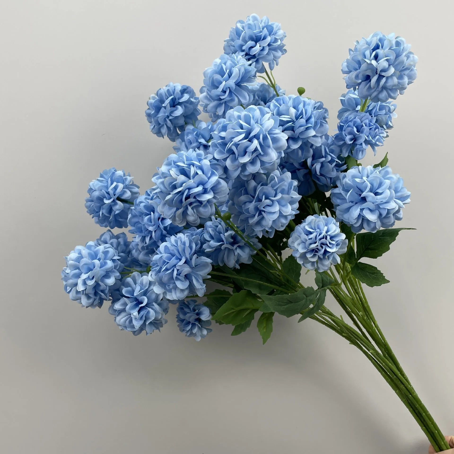 Blue haze artificial silk flower bouquet arranged for decorative display