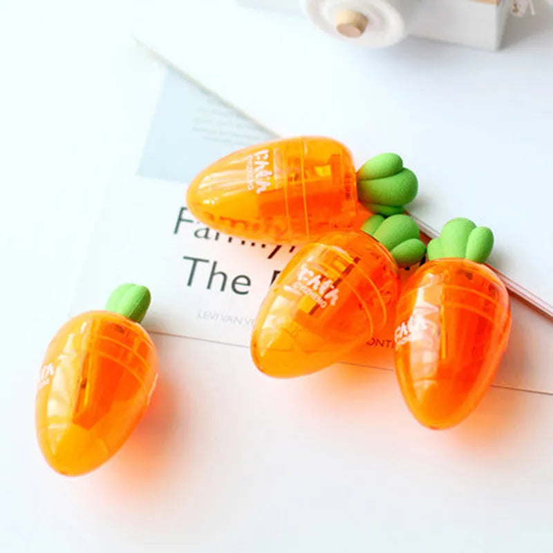 Carrot-shaped plastic pencil sharpener with 7cm handle in carrot colour