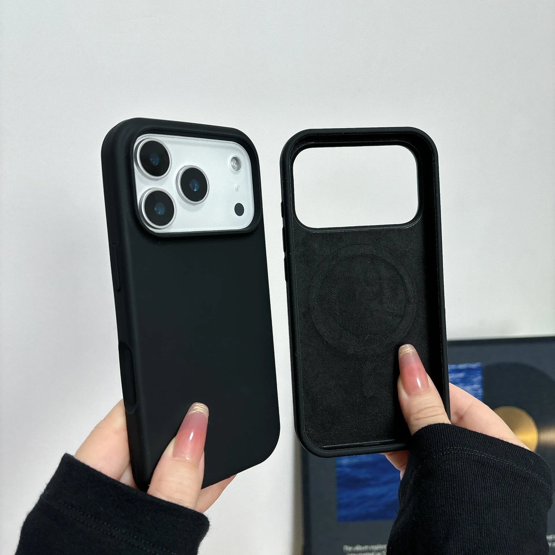 Liquid silicone magnetic iPhone case with Ai button in antique white colour on a table.