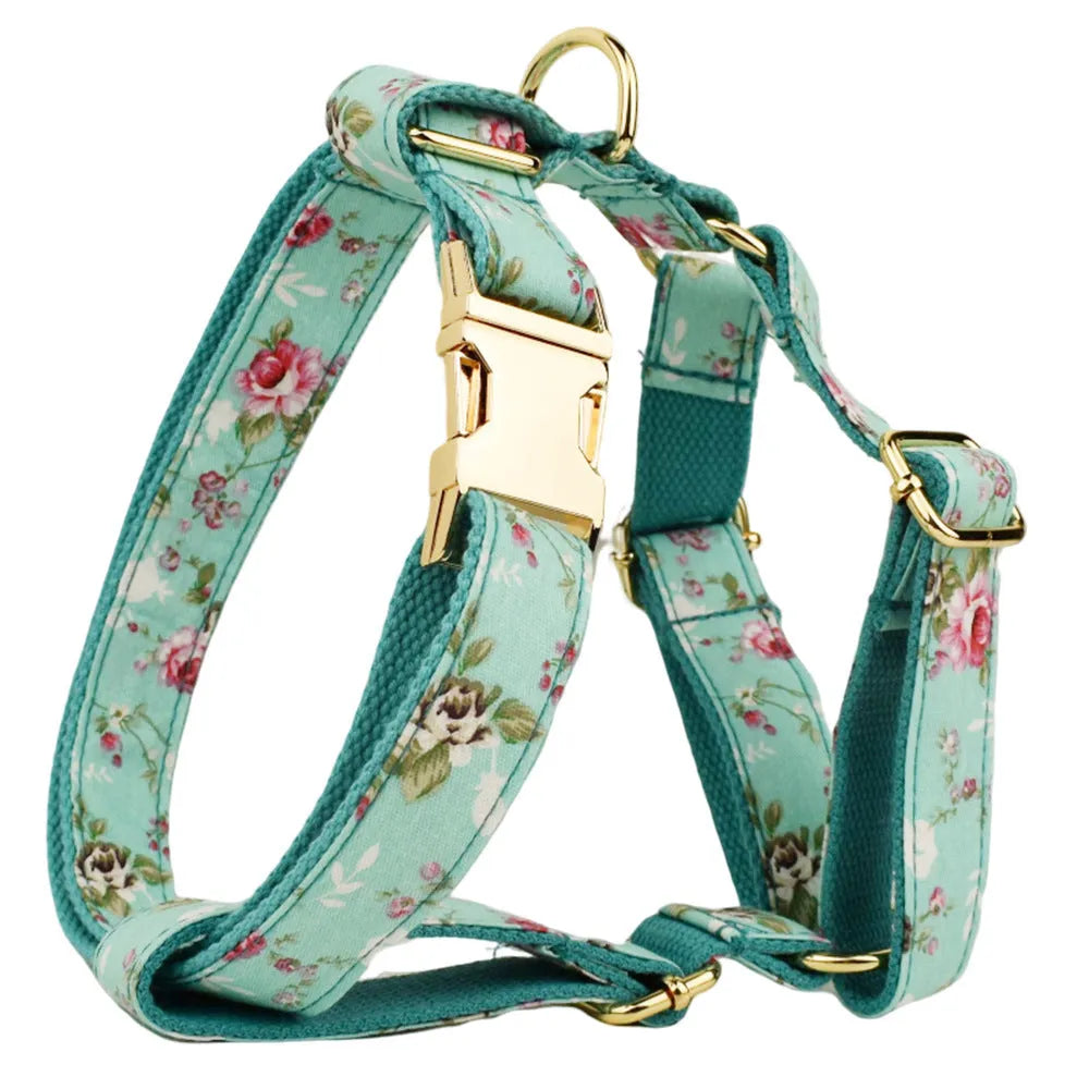 Rose print dog collar set with green background including collar, leash, detachable bow, and vest