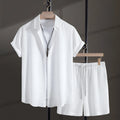 Men's loose fit cotton blend beach suit with short sleeve shirt and shorts in white.