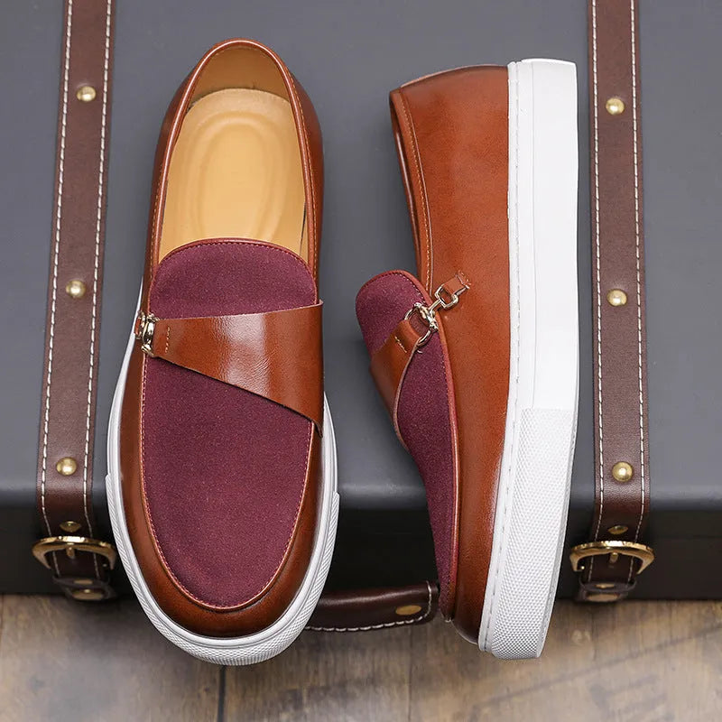 Men's black artificial leather slip-on shoes with a gold horsebit buckle and round toe on a rubber sole.