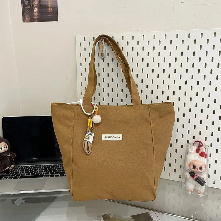 Canvas casual large capacity shoulder bag for women in black with colour blocking and pendant