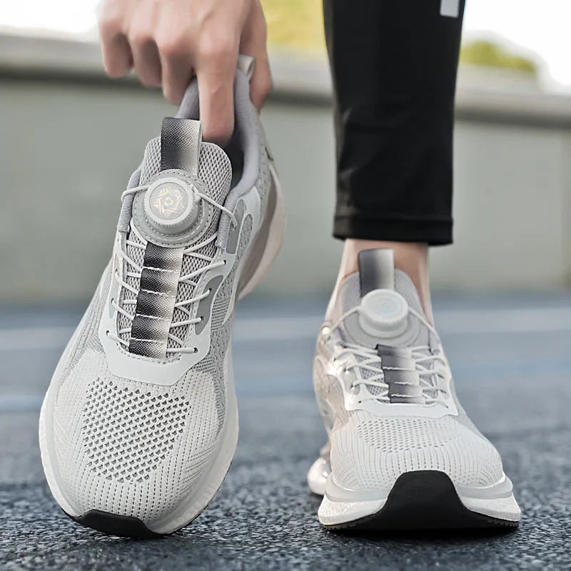 Men's white low-top running shoes with a rotating buckle fastener and breathable mesh upper.