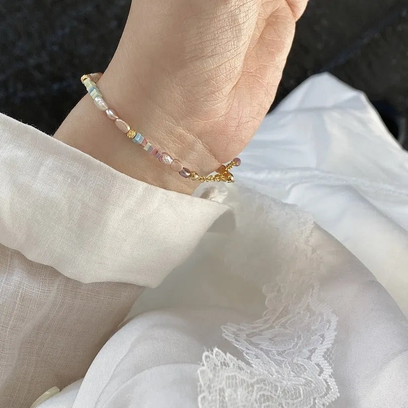 Women's natural pearl bracelet and necklace set with 14K gilded purple silver accents on irregular mini pearls