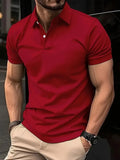 Man wearing a slim-fit solid colour short sleeve button-up casual shirt in a cotton blend fabric.