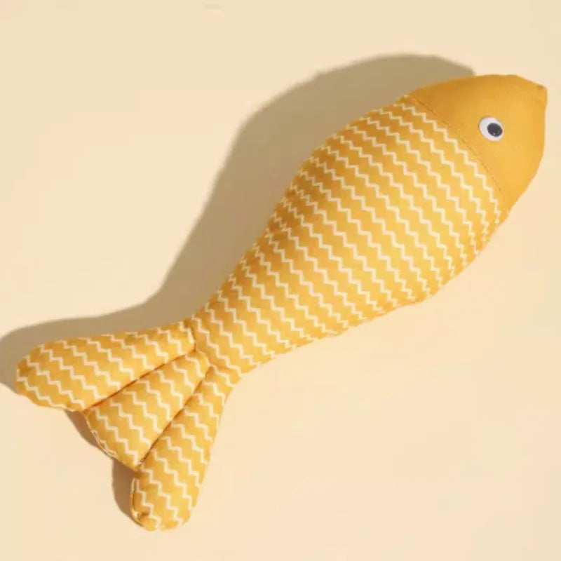 Fish-shaped catnip cat toy in blue with cat playing nearby, available in multiple sizes