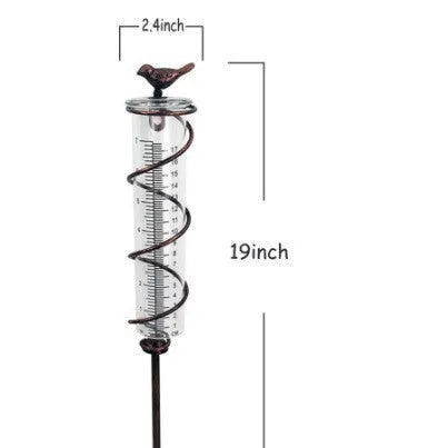 Cast iron bird glass hyetometer rain gauge with hummingbird decoration showing measurement scale