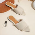 Women's apricot denim slippers with a tassel and leather lining on a lightweight PVC sole.