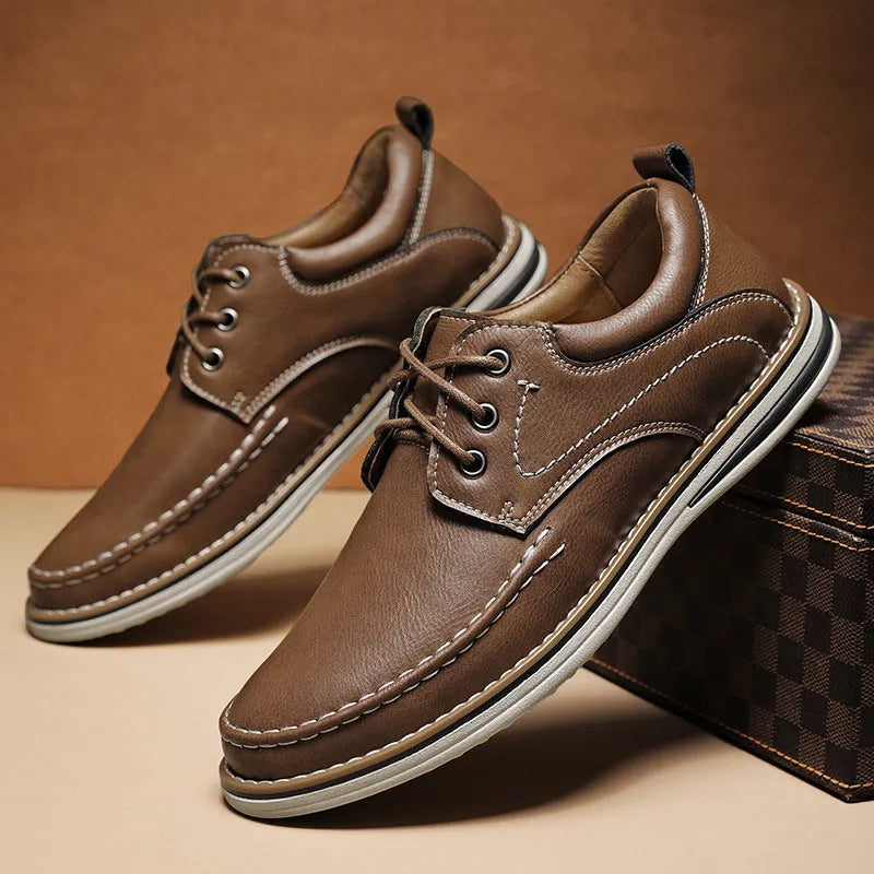 Men's black genuine leather casual lace-up shoes with round toe and rubber sole on a white background.