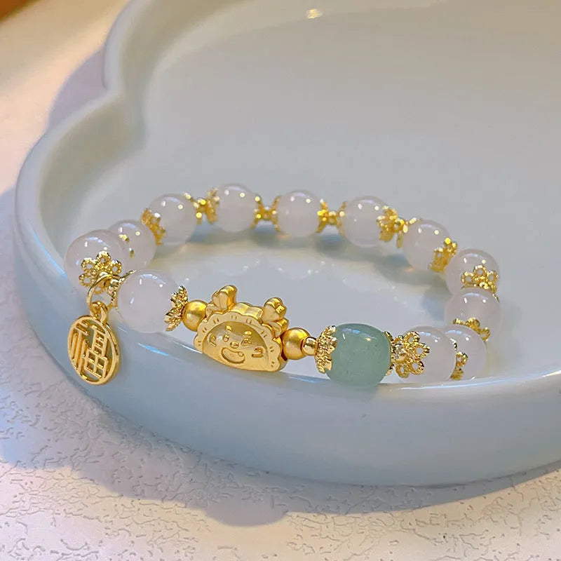 Women's floral glazed zodiac animal bracelet with glass beads in red, pink and white colours