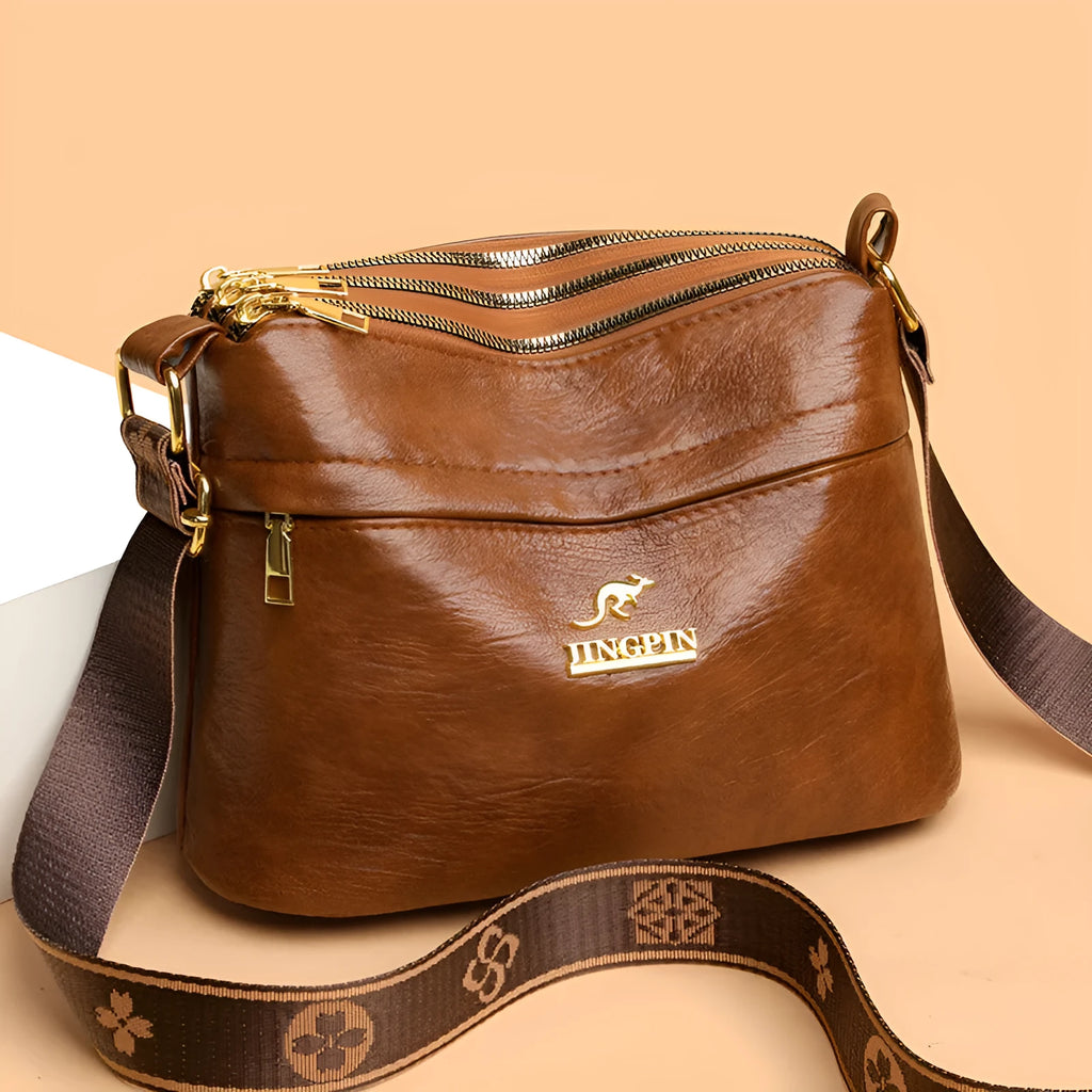 PU leather cross body messenger bag with multiple compartments in horizontal square suitcase shape