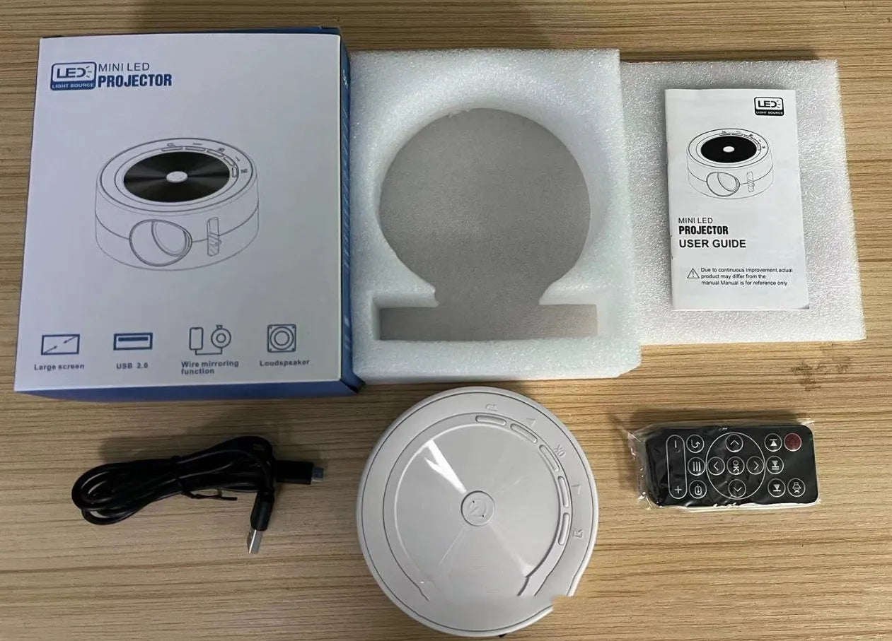 YT200 portable LED projector in four colour options showing 110mm diameter compact design