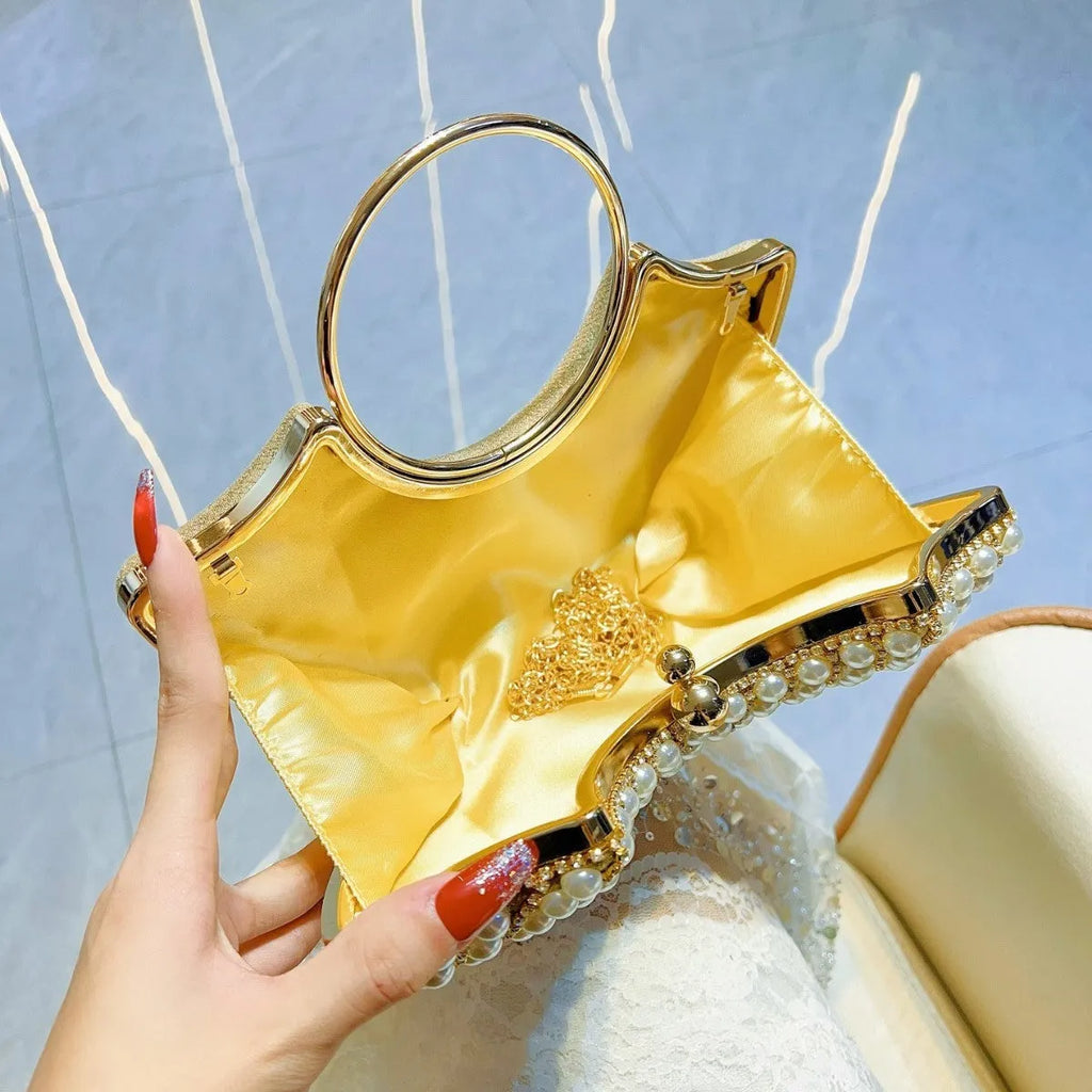 Gold and silver polyester crossbody handbag with diamond detail and hard pillow shape