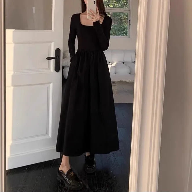 Black square collar knitted A-line dress with elastic waist and long sleeves on a model