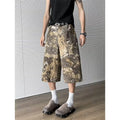 Yellow snake pattern camouflage cropped jeans in cotton denim.