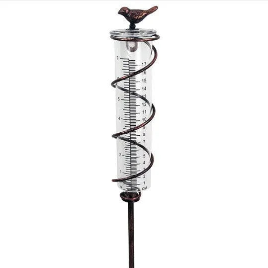 Cast iron bird glass hyetometer rain gauge with hummingbird decoration showing measurement scale