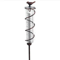 Cast iron bird glass hyetometer rain gauge with hummingbird decoration showing measurement scale