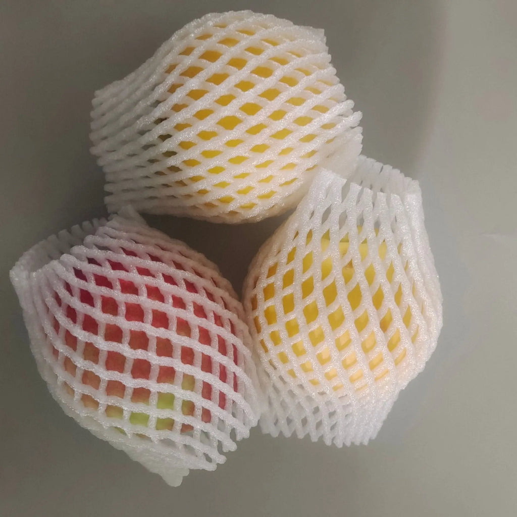 White foam protective net cover for apples, pears, peaches and oranges.