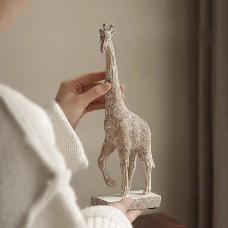 Wood colour giraffe resin ornament on a table, showing European style design and 30.5cm height.