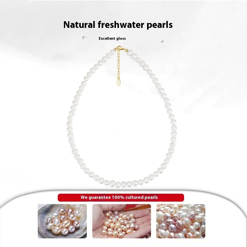 Close-up of a women's adjustable necklace with freshwater pearls on a sterling silver chain.