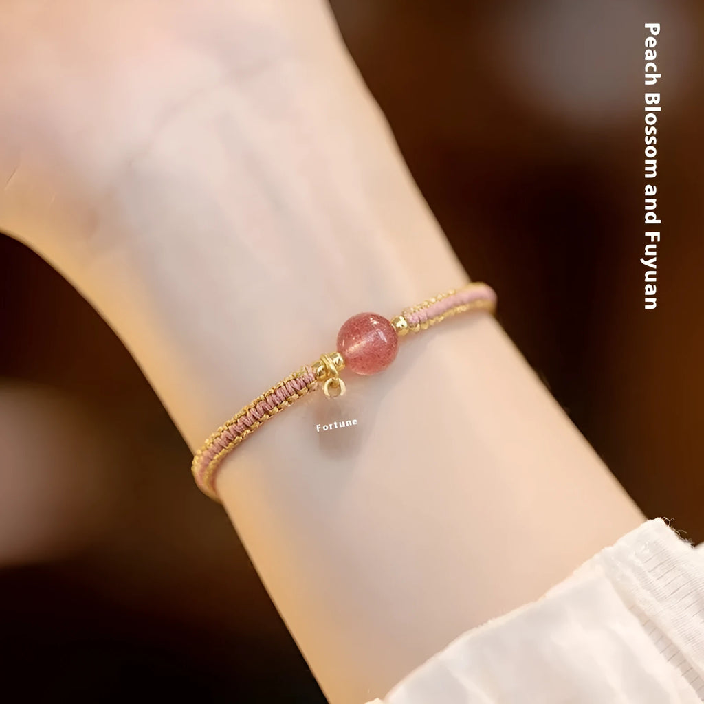 Adjustable red rope bracelet with strawberry quartz gemstones in traditional Chinese style