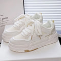 Beige children's lace-up board shoes with cross shoulder straps and a thick rubber sole.