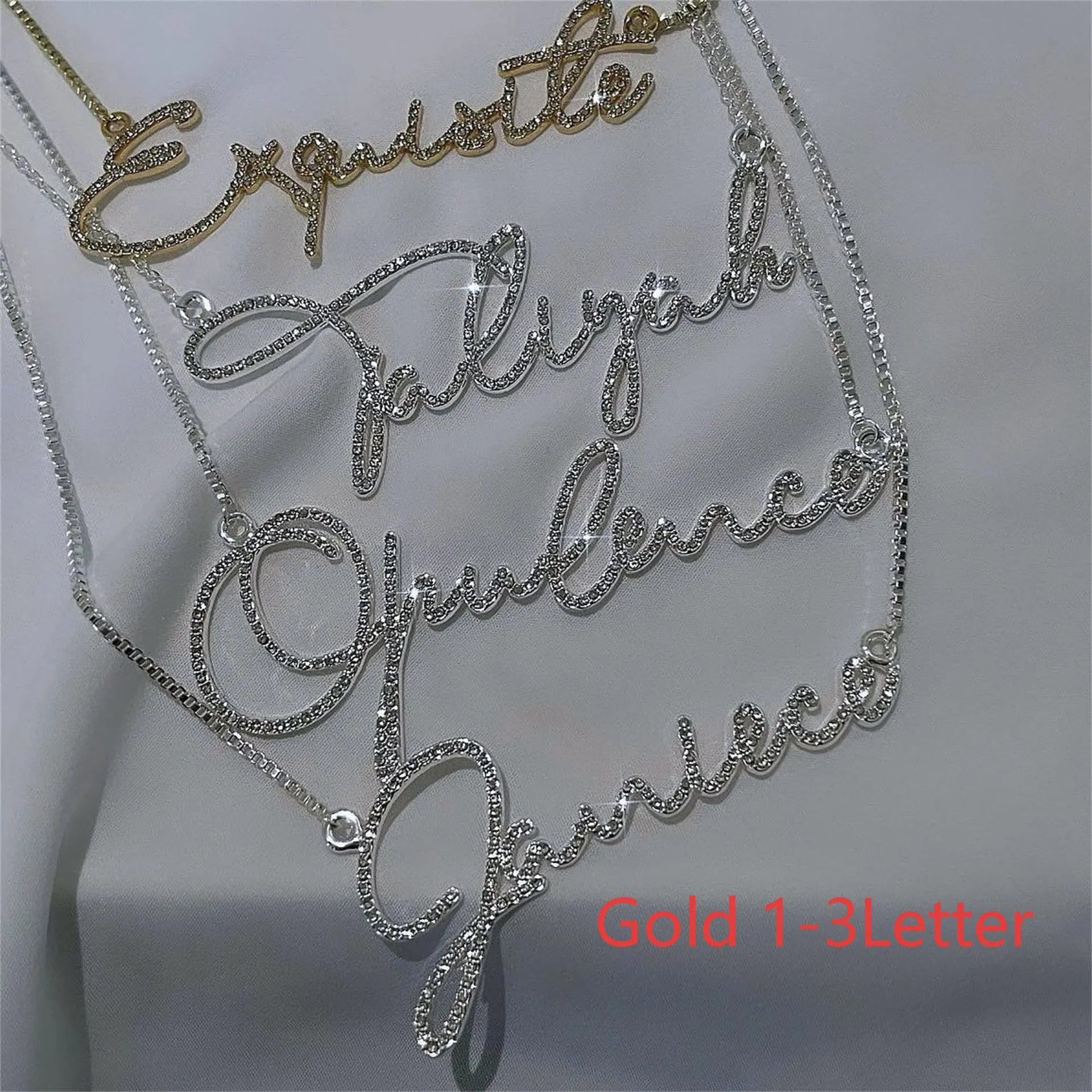 Stainless steel personalised name necklace with diamond studs on a silver chain, showing the letter 'A'.