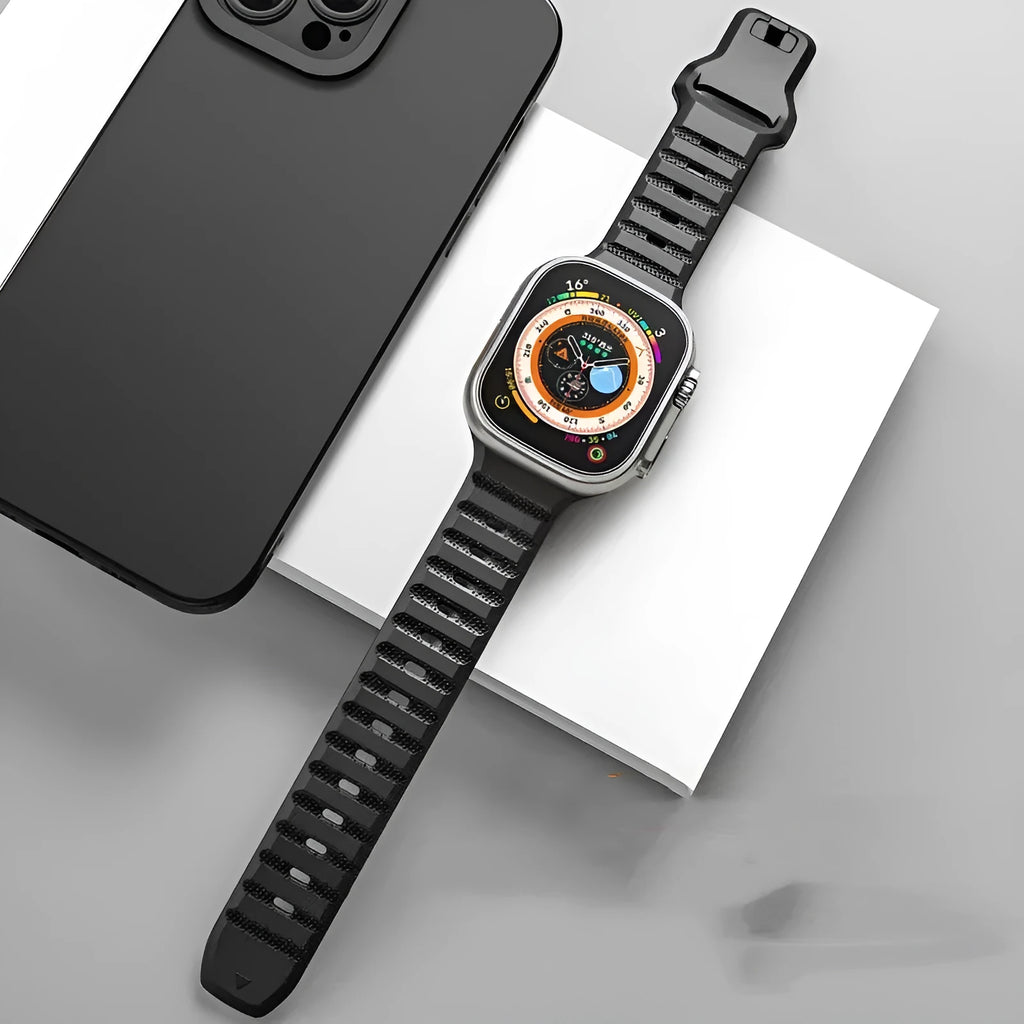 Fluoro rubber watch strap for Apple Watch with T buckle in multiple colour options on a grey background.