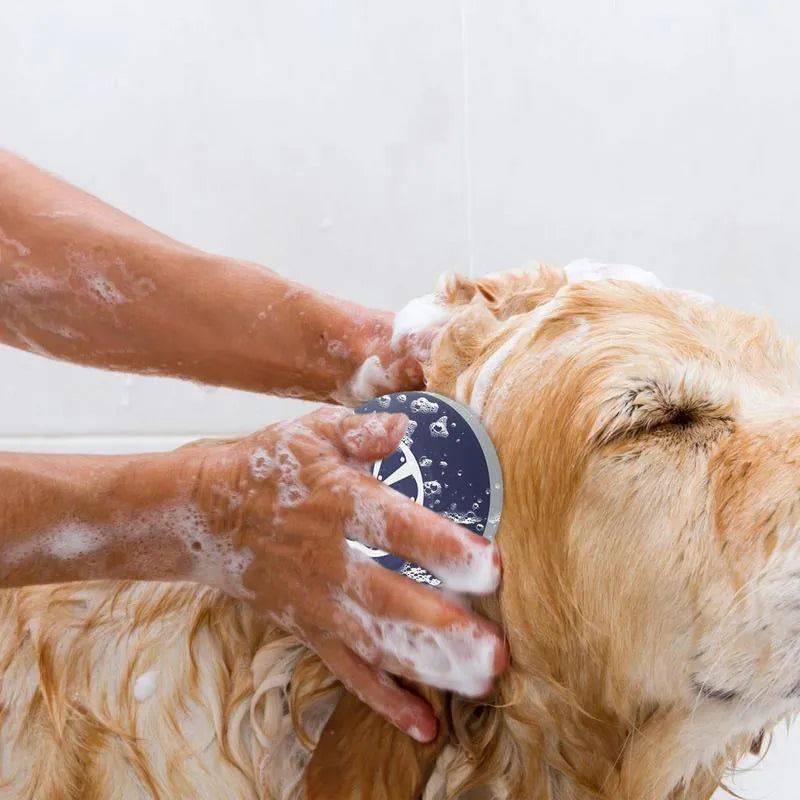 Blue 3-in-1 dog shampoo brush with silicone massage head and non-slip handle for bath time.