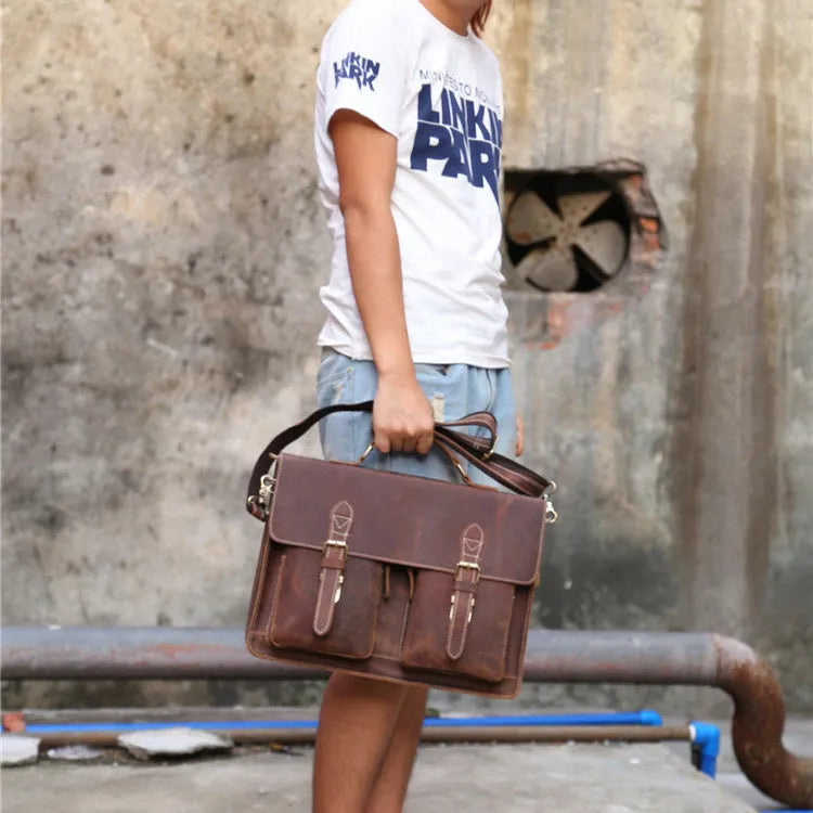Small yellow brown Crazy Horse leather messenger bag with shoulder strap and nylon lining.