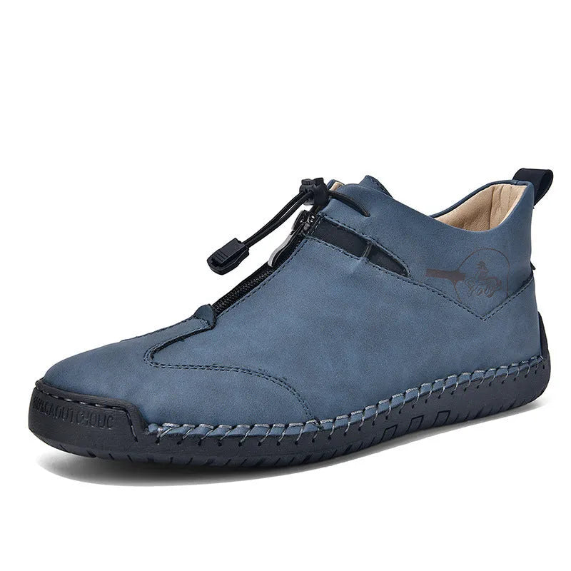 Casual men's leather travel shoes in black with rubber sole, mid heel, and round toe