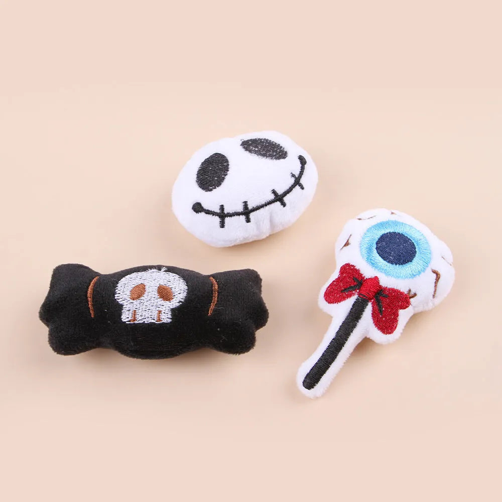 Small handheld cat teaser with plush candy and eyes attachments on wand