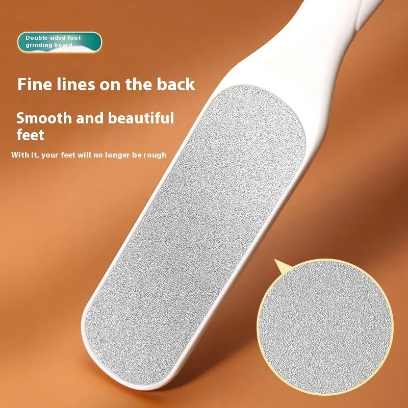 Double-sided stainless steel foot grinder with white and black sandpaper surfaces for callus removal