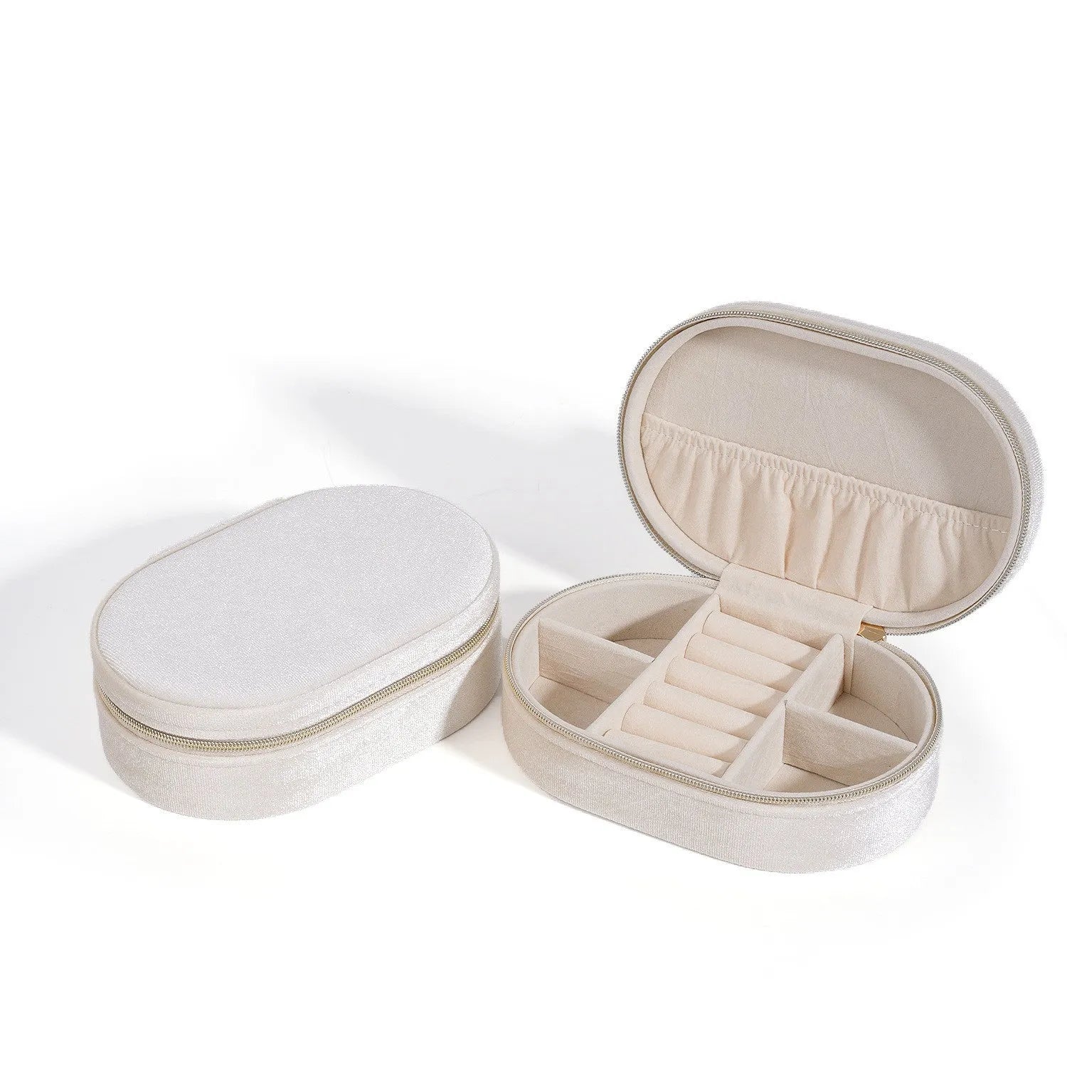 Oval velvet jewellery storage box in multiple colours with flannel lining, showing compact 15x10x5 cm size.