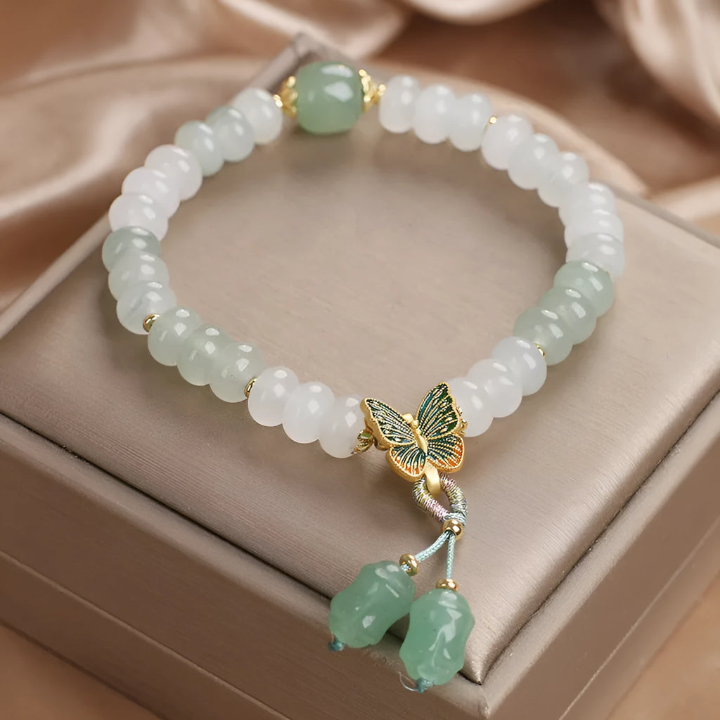 Green Tian Shan Cui abacus bead bracelet with crystal detailing and butterfly tassel