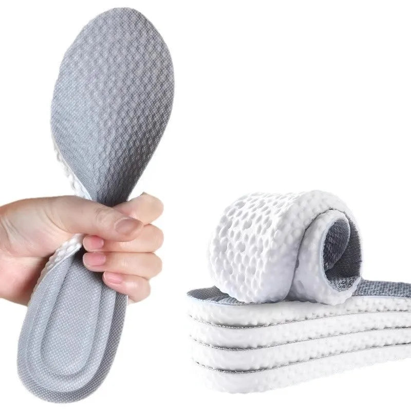 Breathable deodorant sports insoles in grey, black, and orange colours on a white background.