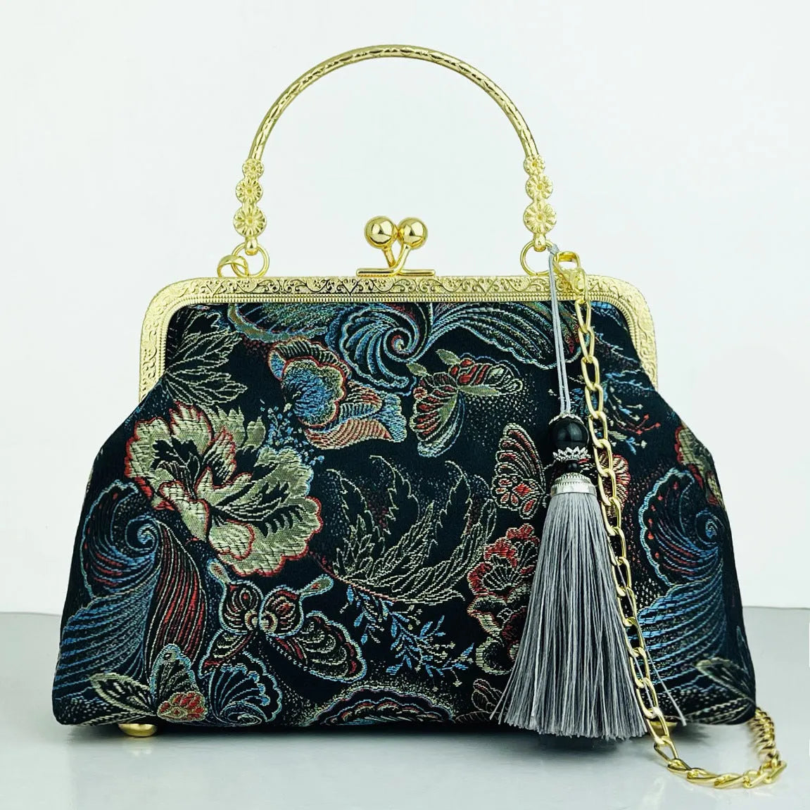 Chinese embroidery cheongsam handbag in polyester with shell shape and internal zipper compartment