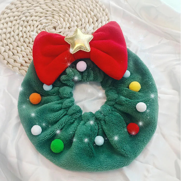 Green Christmas pet bow-knot collar with colourful fuzzy balls on a cat or dog for festive photo props