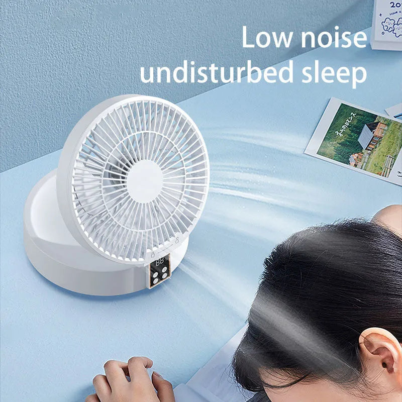White portable folding fan with remote control on desk showing night light and adjustable angle