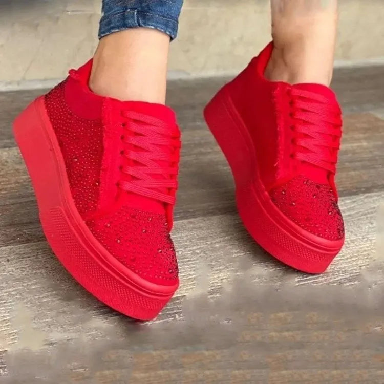 Women's black casual sports shoes with lace-up front, rhinestone detail, and thick rubber sole.