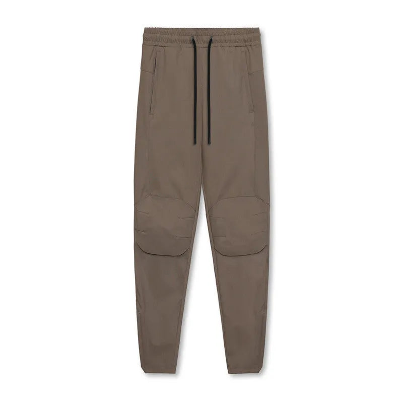 Men's loose grey running pants with ankle ties, quick-drying polyester fitness trousers for exercise