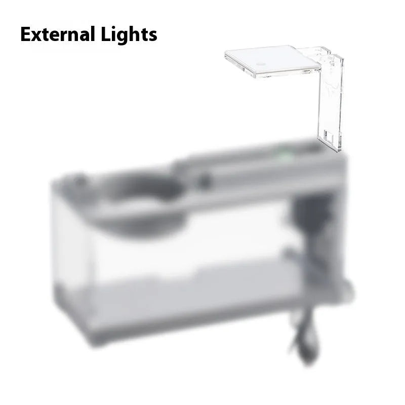 Small stone trough plastic fish tank with water pump and built-in light on a desk