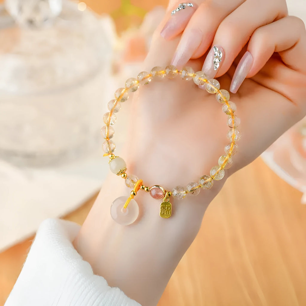 Gold rutilated quartz crystal bracelet with safety buckle and geometric pendant in national style design