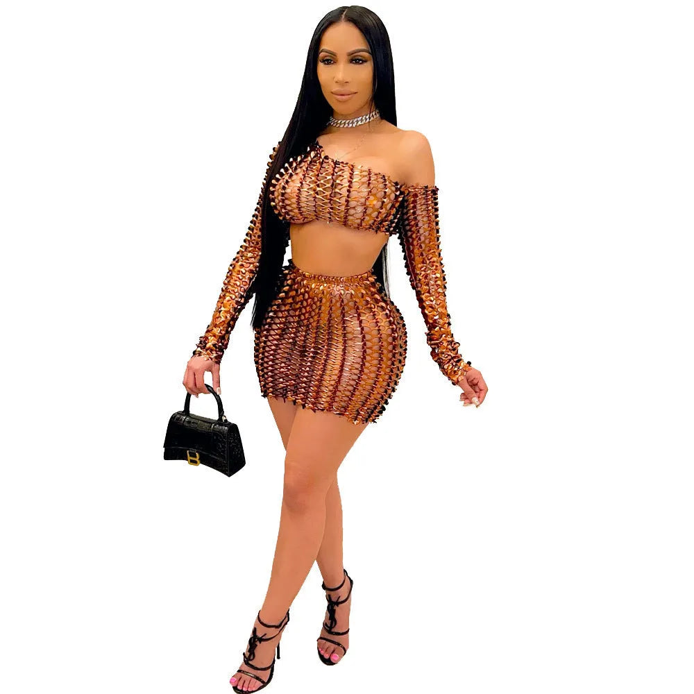Women's black hollow-out net sleeveless top and short skirt two-piece dress set on a hanger.
