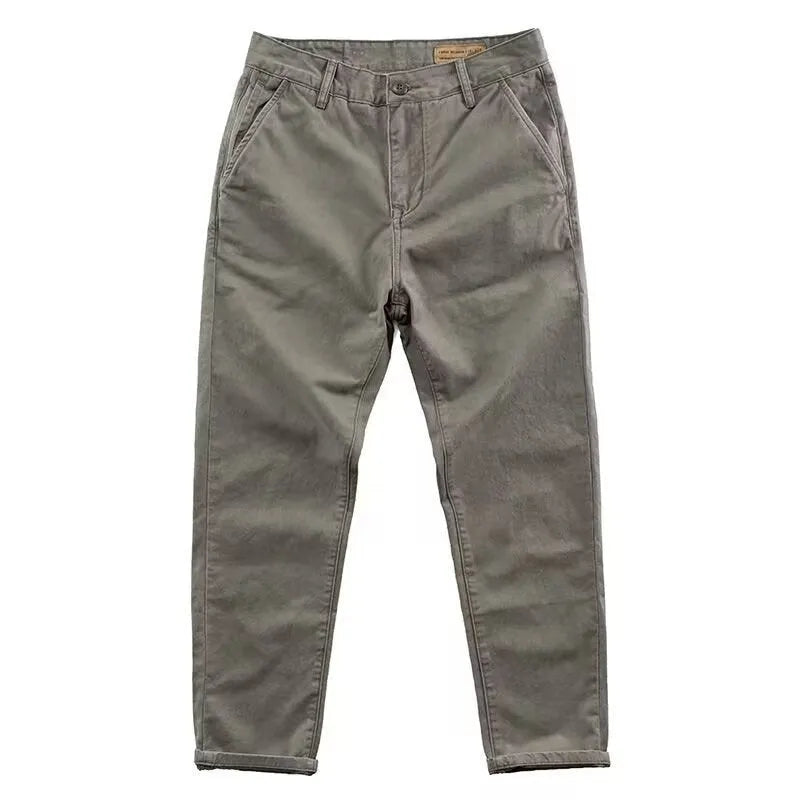 Men's slim fit casual trousers in grey with a straight leg design, made from a micro-elastic fabric blend.