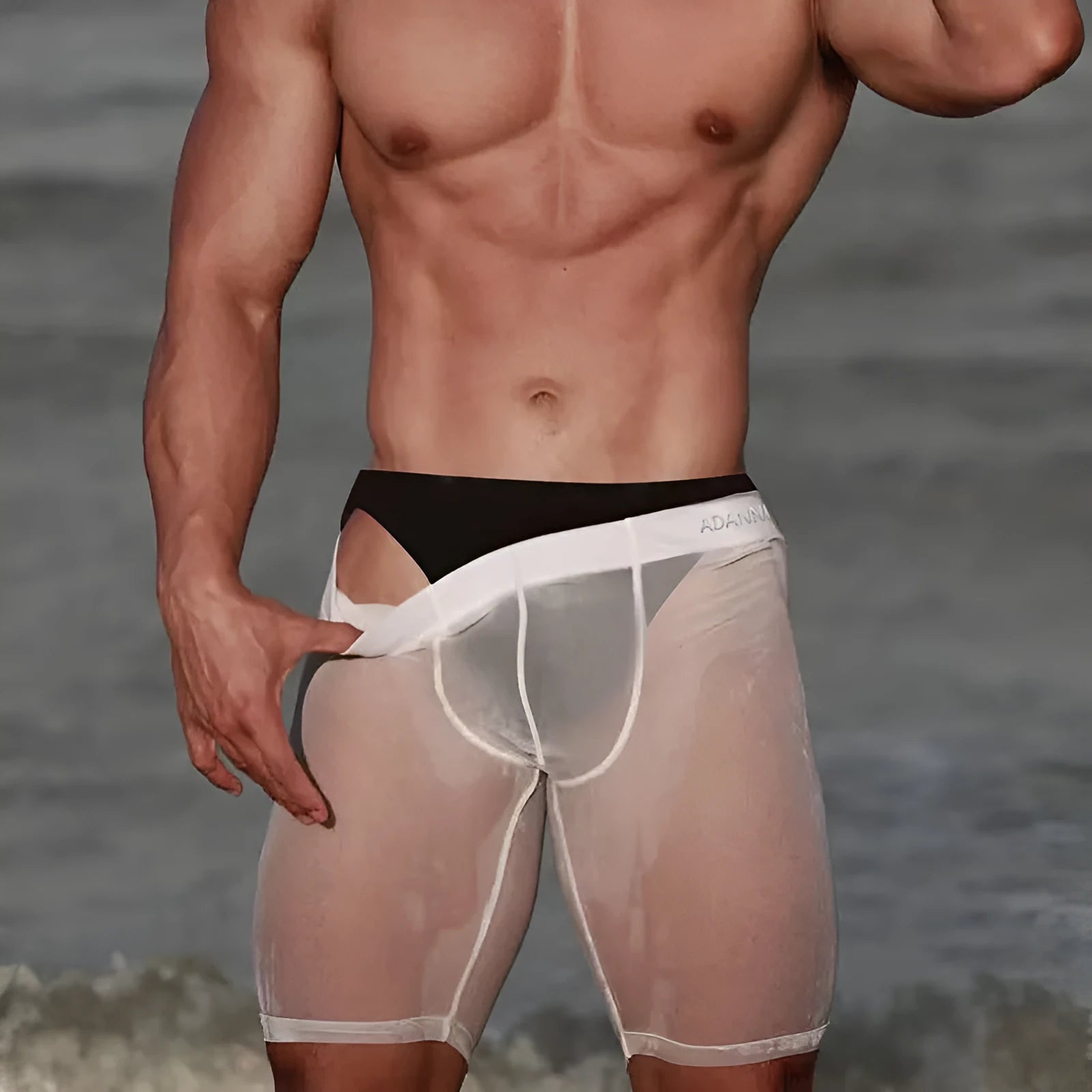 Men's black seamless mesh home shorts with a hip-lifting function, made from knitted nylon fabric.